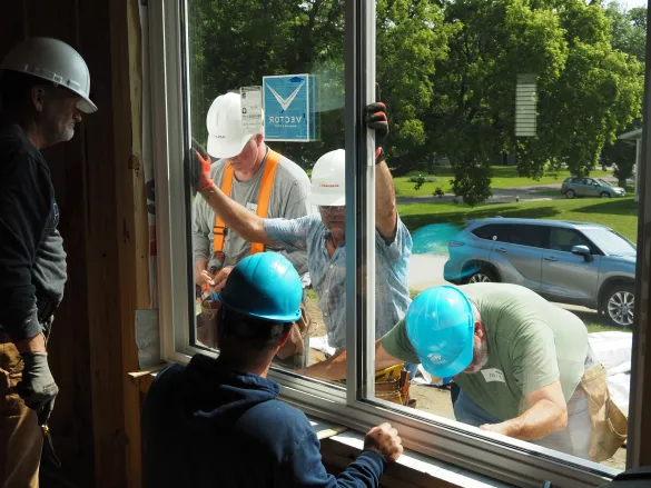 Habitat for Humanity team install high performance windows.
