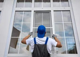 Contractor installing window