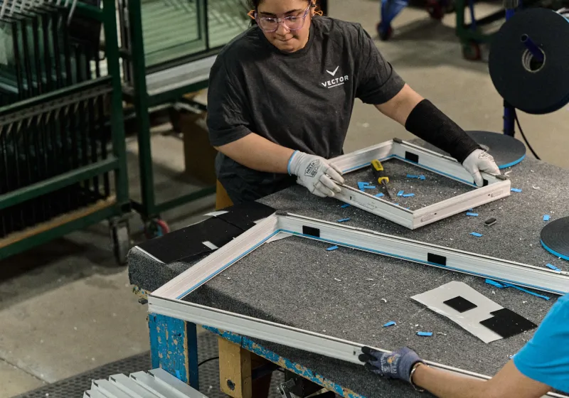 Worker at the Vector Windows manufacturing facility