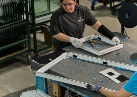Worker at the Vector Windows manufacturing facility